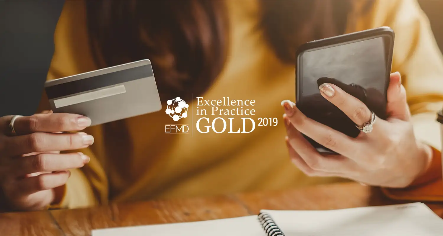 Woman with credit cards with EFMD gold award