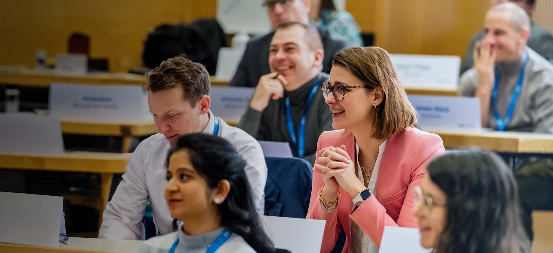 IMD EMBA students in classroom talking