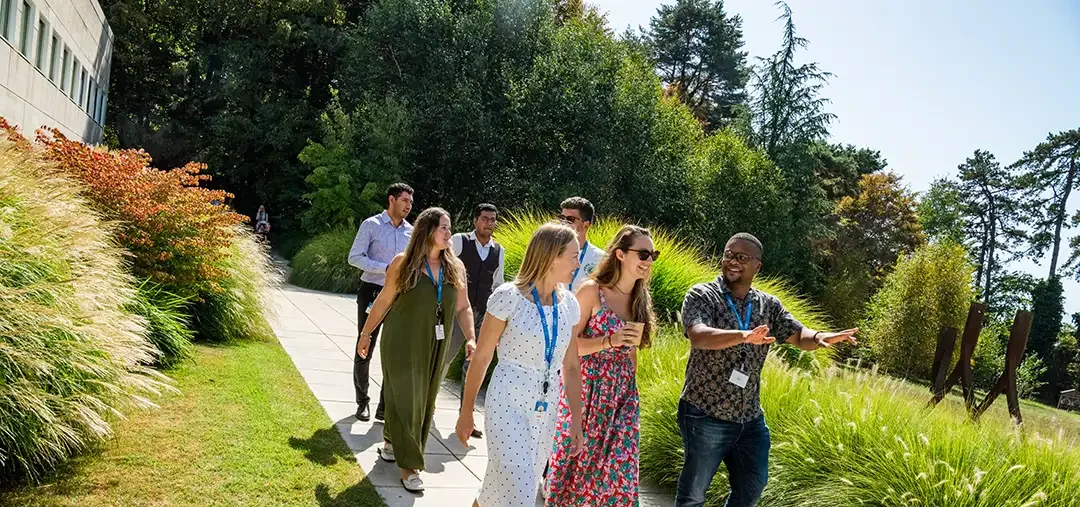 IMD MBA students walking around campus in June 2023 - IMD Business School