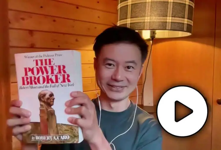 Howard Yu holding the book "The Power Broker" - IMD Business School